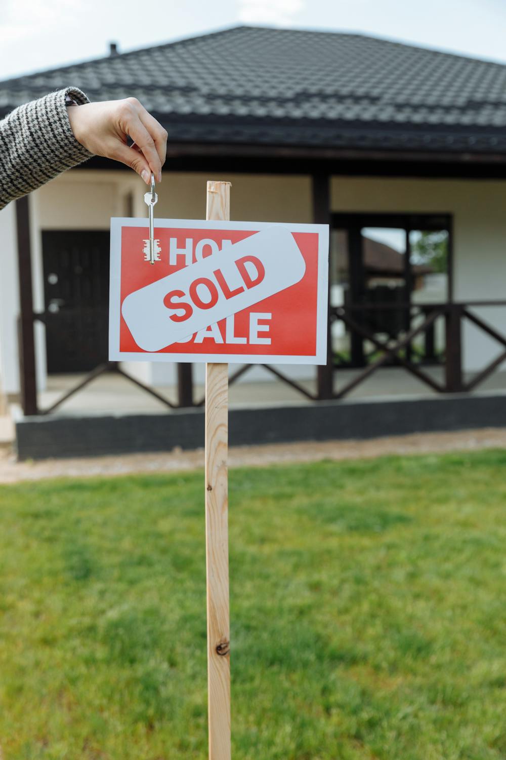 Real estate agent welcoming client at front door
